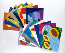 Load image into Gallery viewer, array of 16 colorful postcards, including postcard of three sunflowers tilted towards each other over a river.
