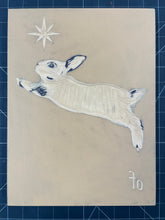 Load image into Gallery viewer, Linoleum block partially carved with a star, bunny, and the word &quot;of&quot;.
